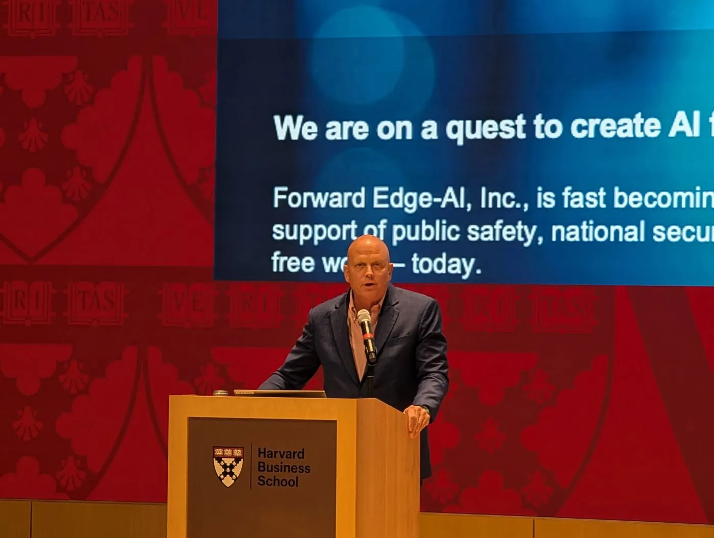 Ross Coffman delivering a keynote at Harvard Business School